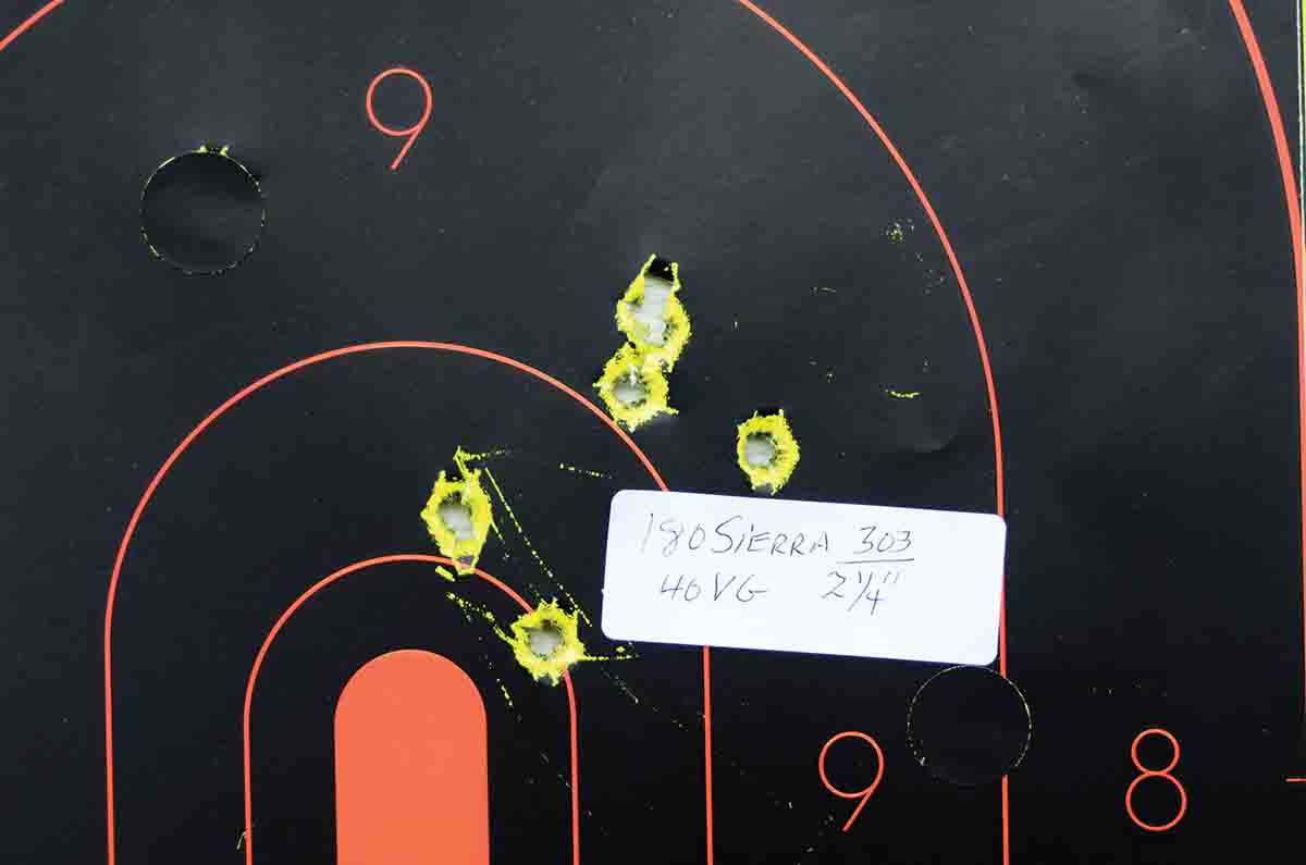 A sample group fired with handloads. Again, note the point of impact right of center.